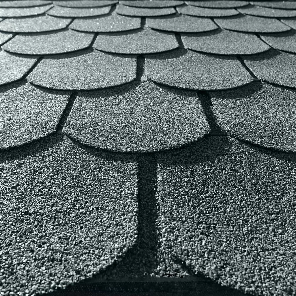 Architectural asphalt shingles with scalloped edges and textured finish